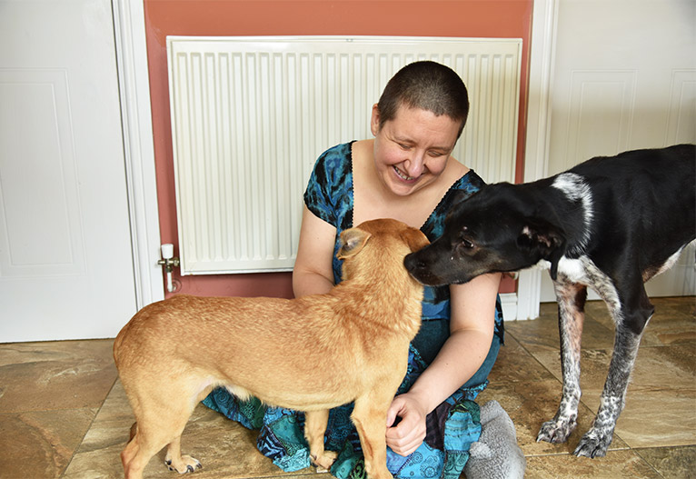 Liz Clifton with two rescued dogs.